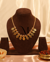 Floral Lakshmi Coin Pendant Necklace in Matte Gold Finish