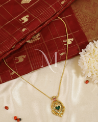 Regal Palakka Stone Pendant with Intricate Gold Framing