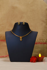 Elegant Gold Necklace Set with Emerald Accents