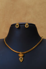 Elegant Gold Necklace Set with Emerald Accents