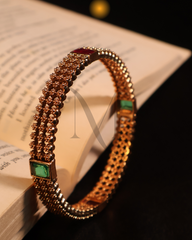 Contemporary Gold Bangle with Emerald and Ruby Accents