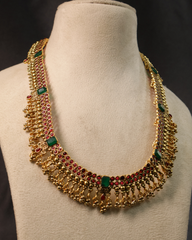 Traditional Kemp Stone Necklace with Green Accents and Jhumka Earrings